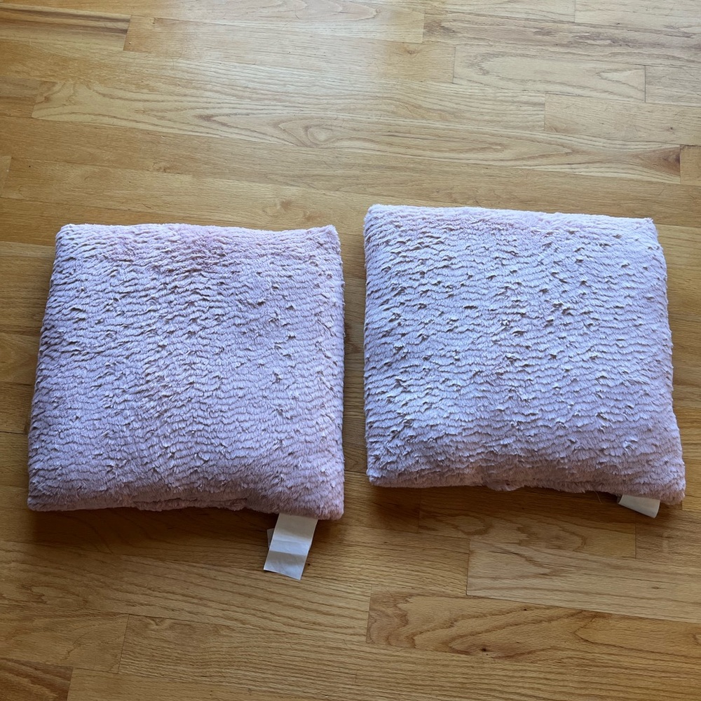Light pink fluffy decorative pillows